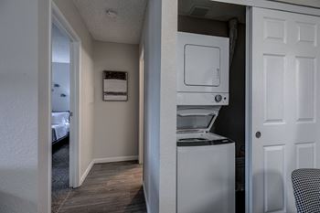 a room with a washer and dryer in it