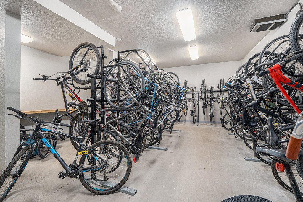 A bike parking room with many bikes.