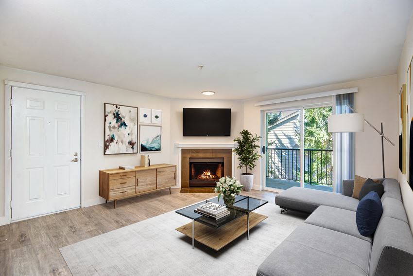 a living room with a fireplace and a tv above it - Photo Gallery