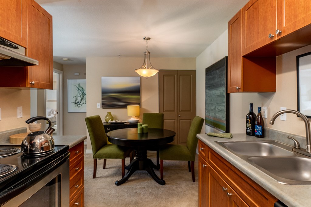 a kitchen and dining area in a 555 waverly unit