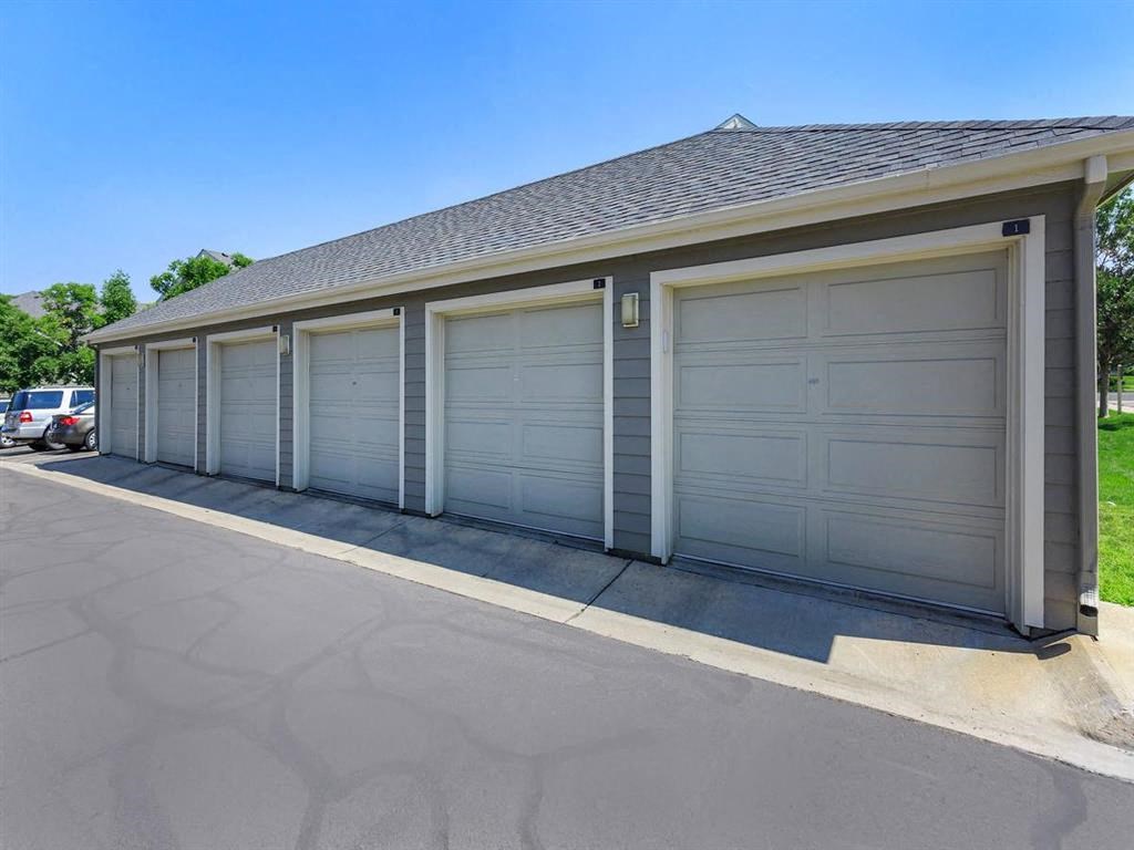 a row of garage doors on the side of a house