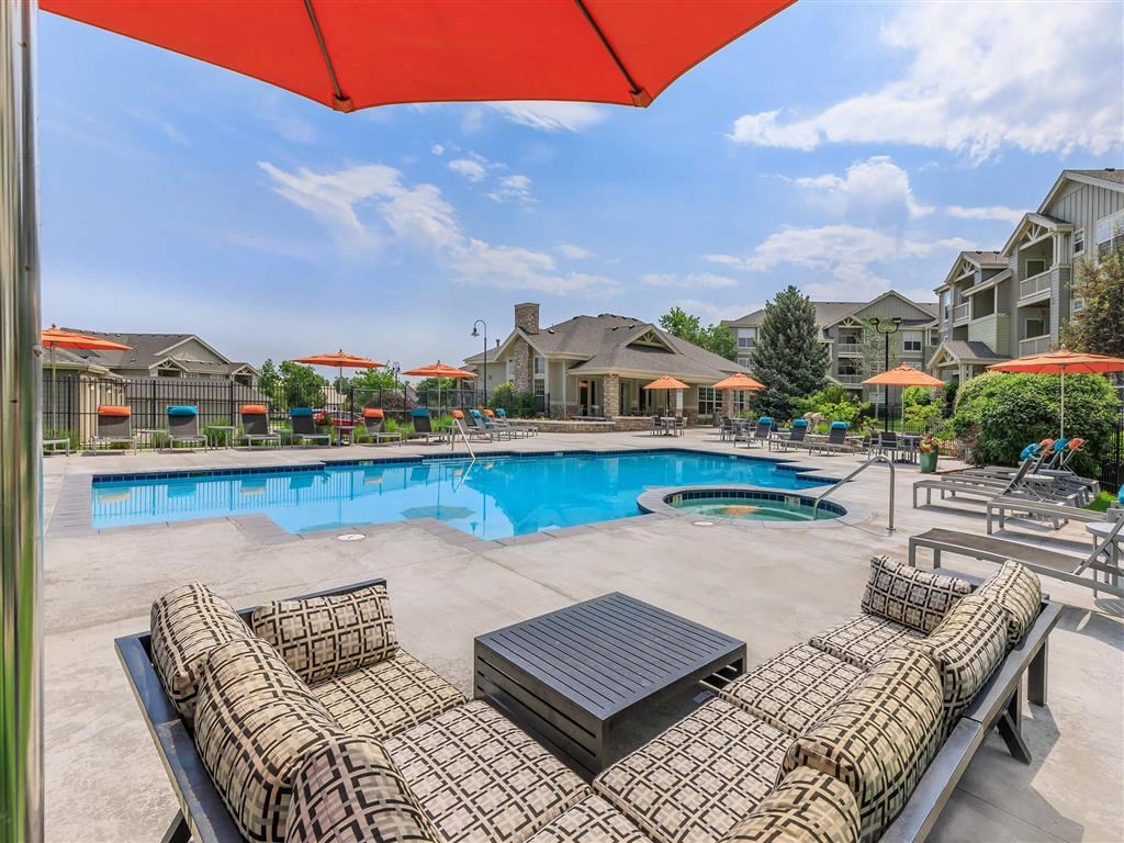 our apartments offer a swimming pool with lounge chairs and umbrellas