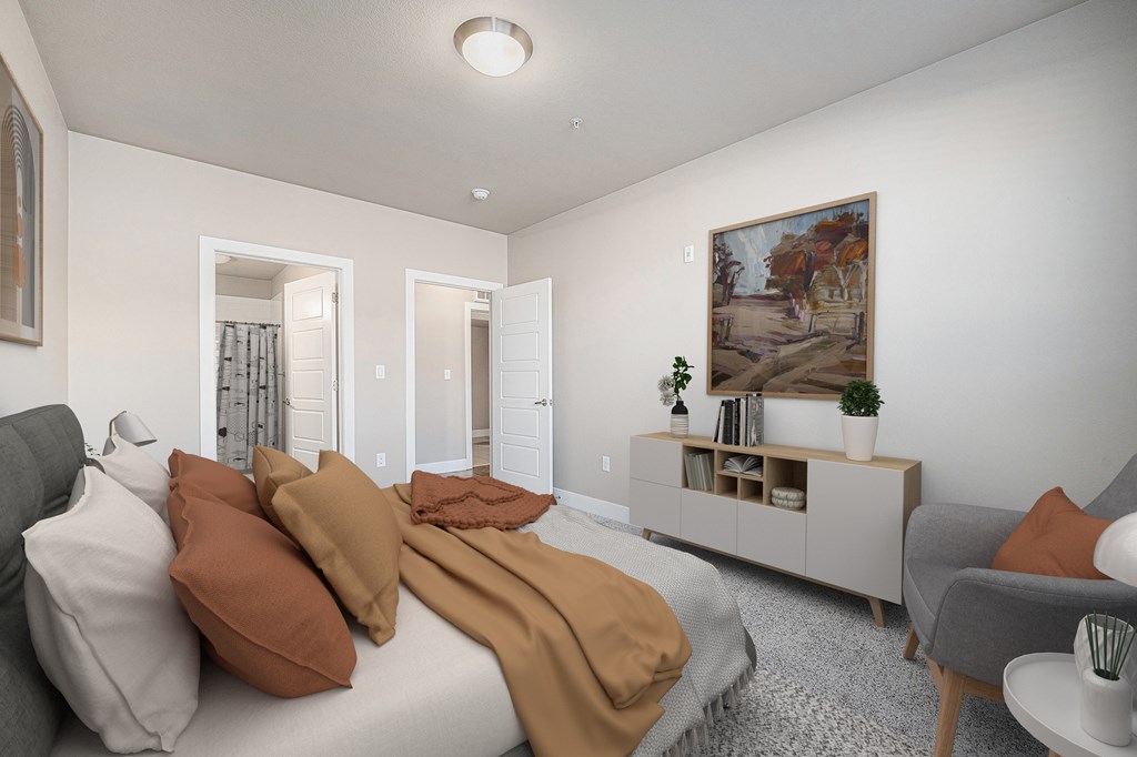 A bedroom with a bed, a chair, and a painting on the wall.