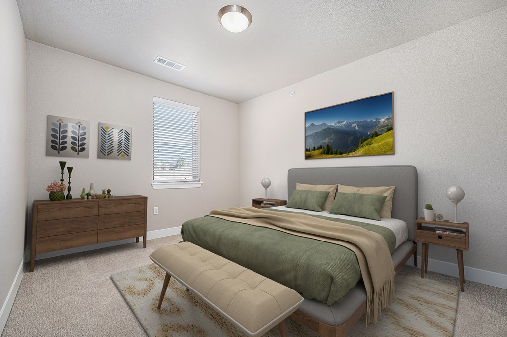 A bedroom with a large bed and a painting on the wall.