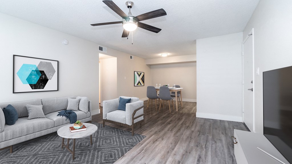 our apartments offer a living room with a couch a chair and a coffee table