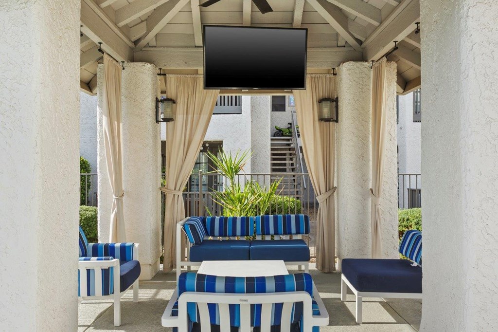 Del Sol Apartments Poolside Patio Lounge with TV