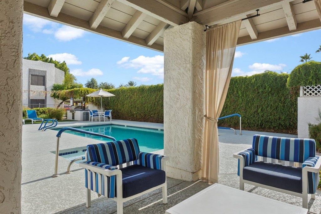 Del Sol Apartments Pool with Lounge Chairs