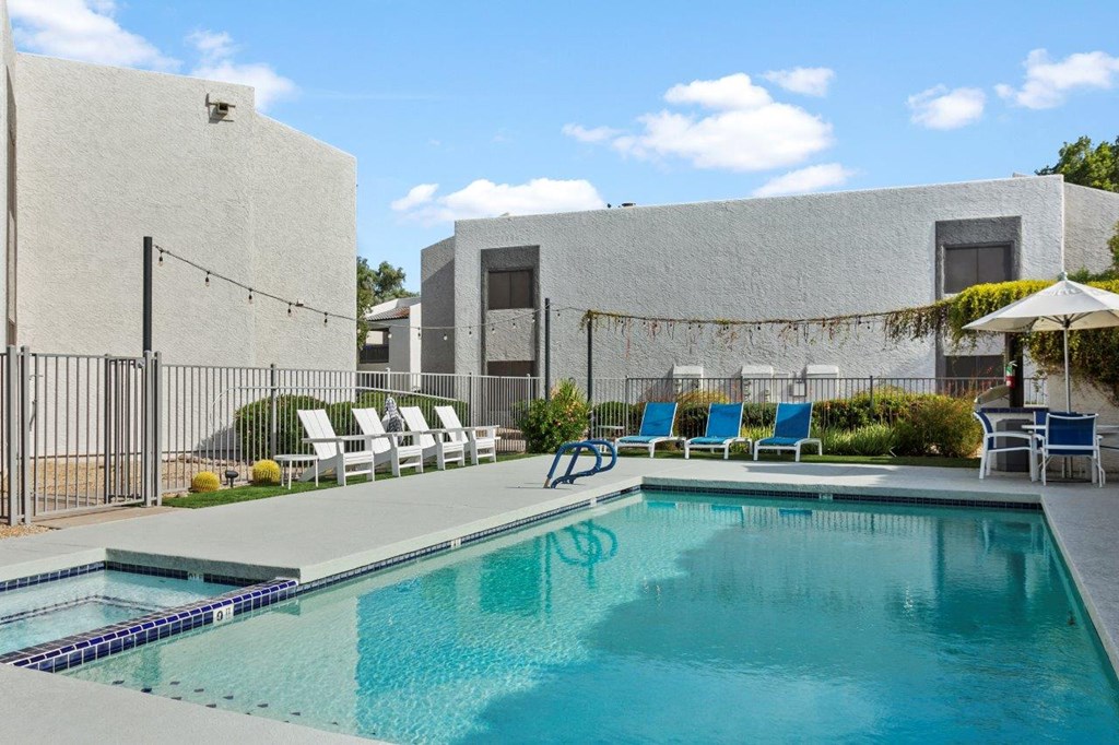 Del Sol Apartments Pool with Lounge Chairs