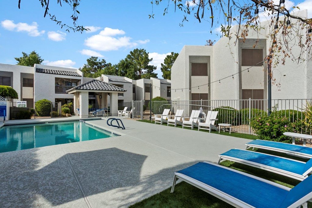 Del Sol Apartments Pool with Lounge Chairs