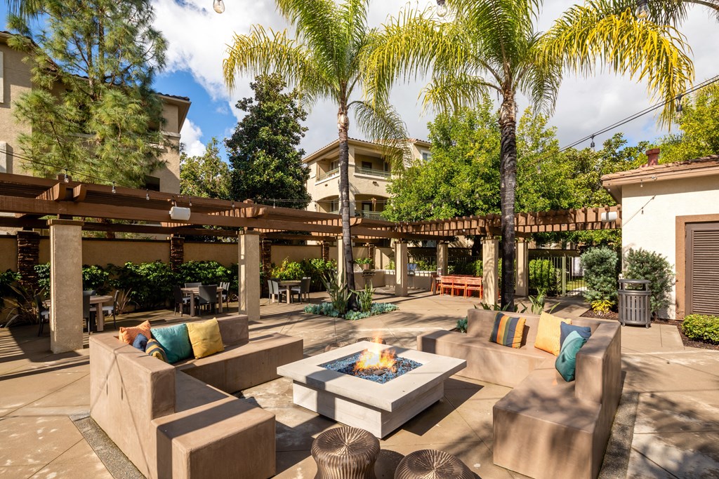 Courtyard with couches and a fire pit