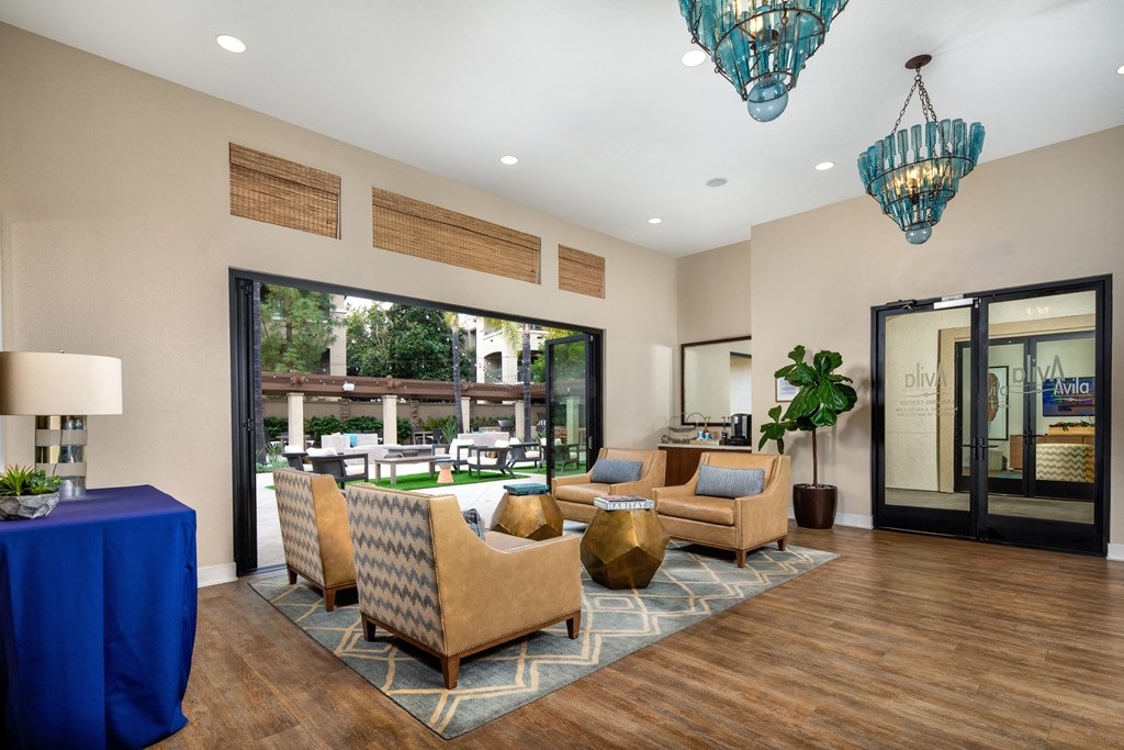 Clubhouse with couches and chairs and a large window