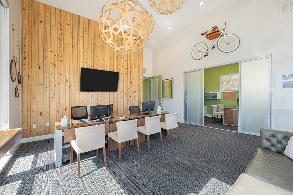 A room with a wooden wall and a television mounted on it.