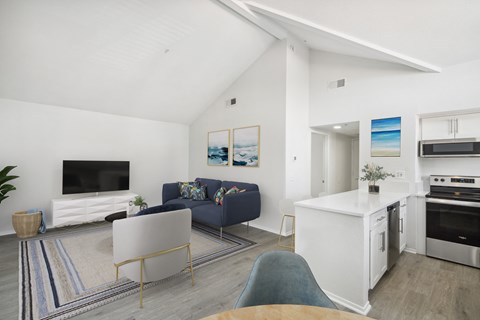 a view of the living room and kitchen from the dining area