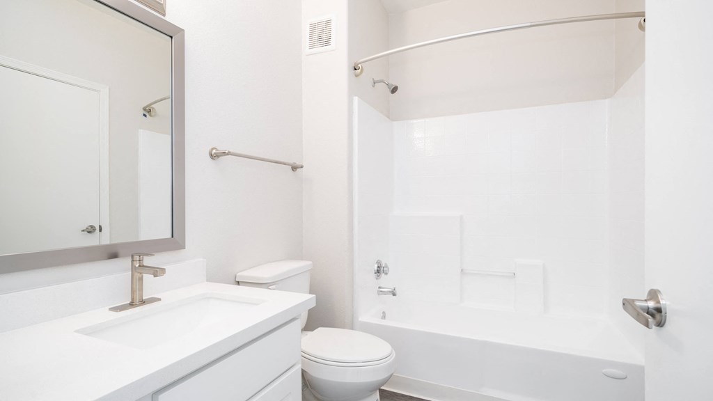a bathroom with a sink toilet and a shower