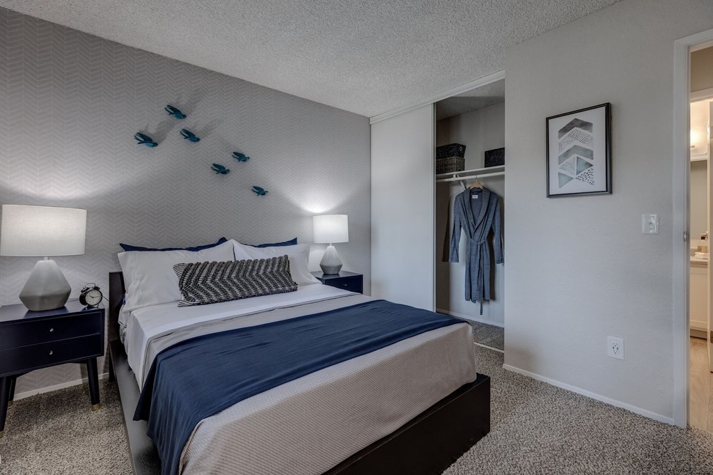 a bedroom with a bed and a nightstand