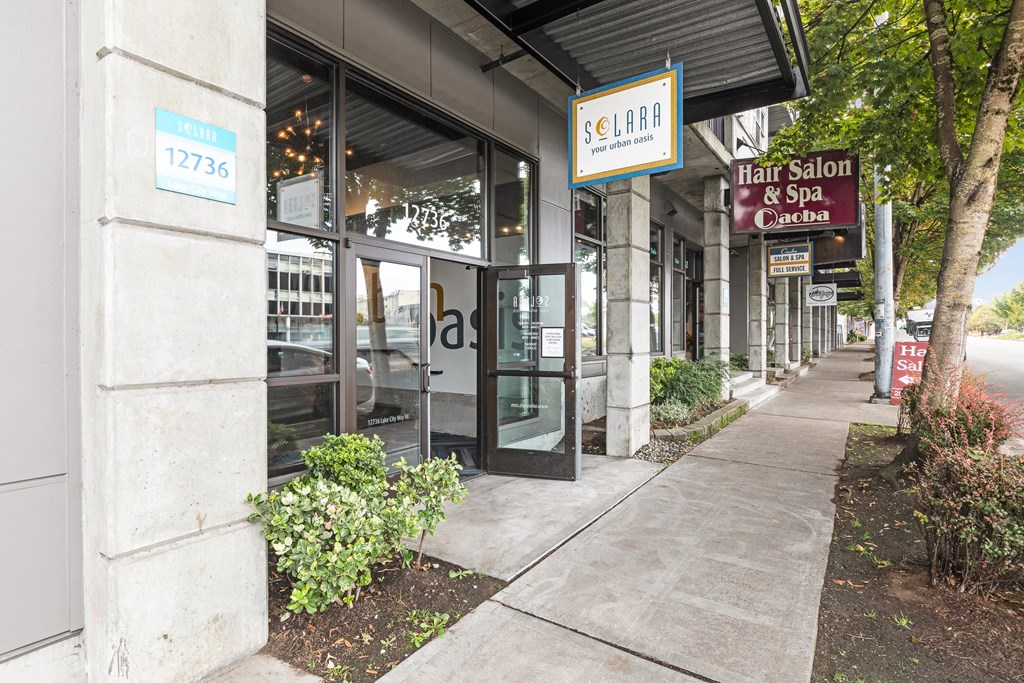 a building with a sign that says hair salon and spa