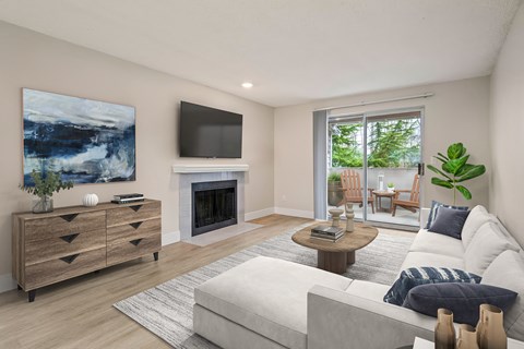 a living room with a white couch and a fireplace