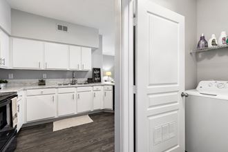 Washer dryer In-unit washer and dryer closet right near kitchen