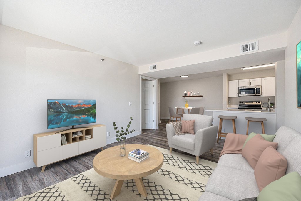 A living room with a television, couch, and coffee table.