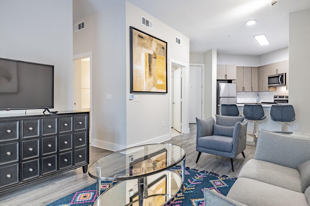 a living room with furniture and a flat screen tv