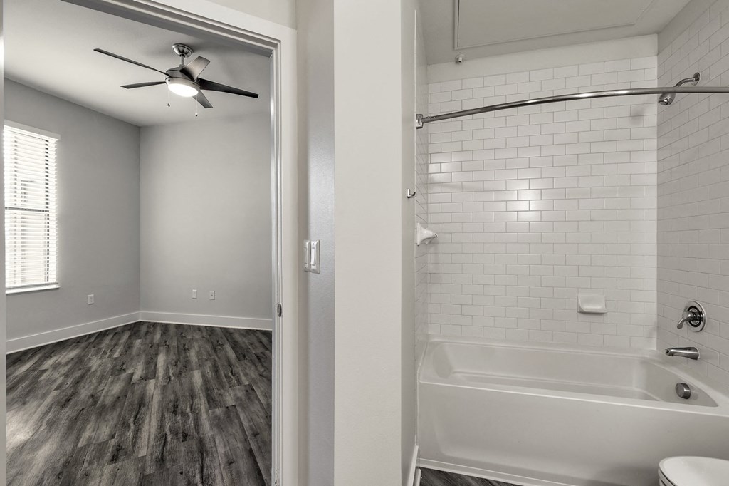 a bathroom with a shower and a tub