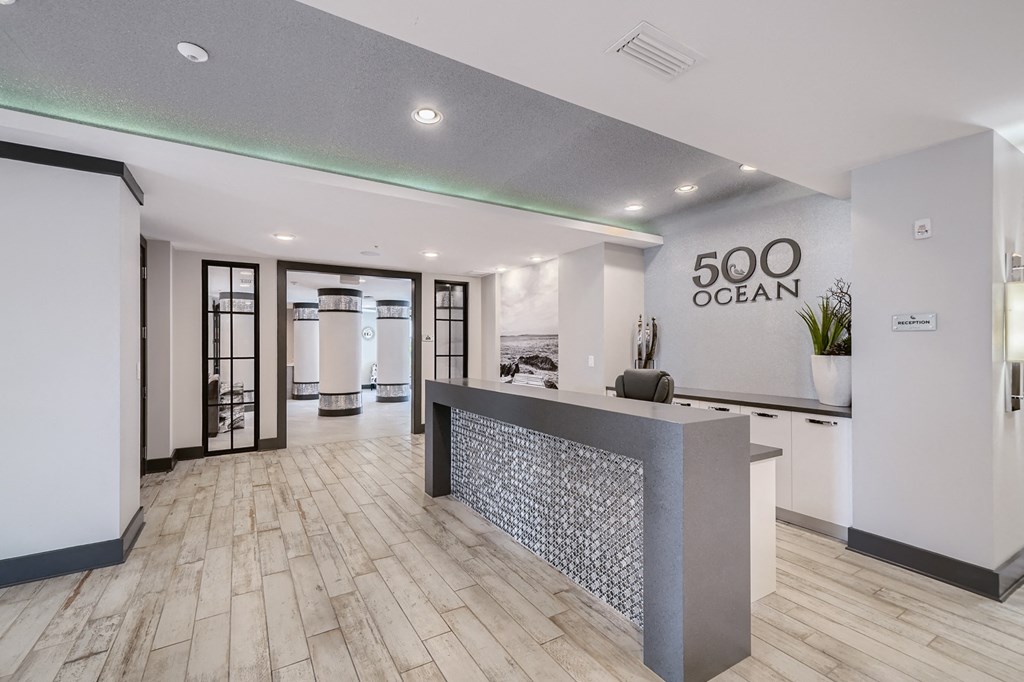 a lobby with a reception desk and a 500 ocean sign