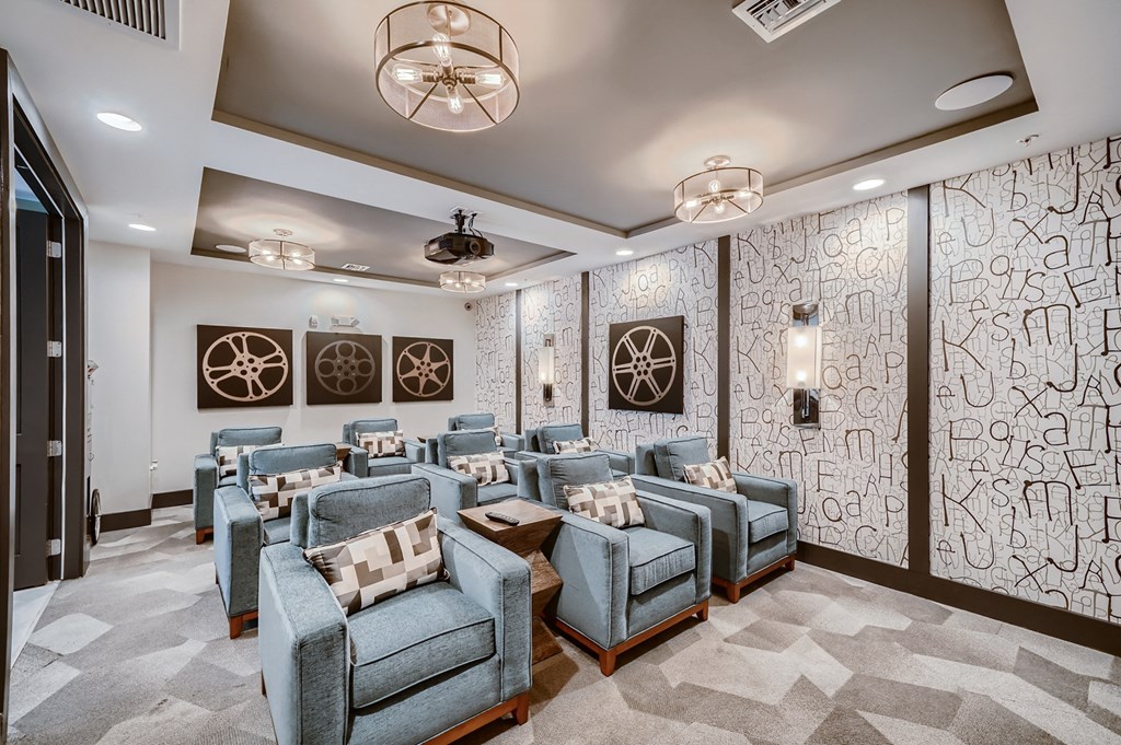 a conference room with blue chairs and a wall mural