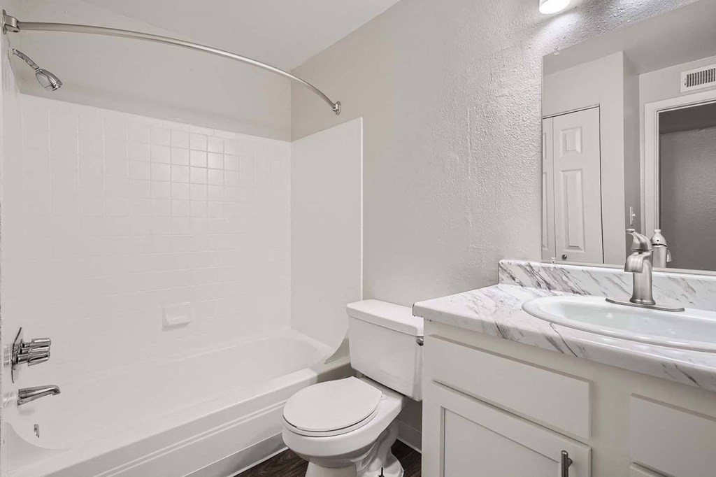 a bathroom with a toilet and a sink