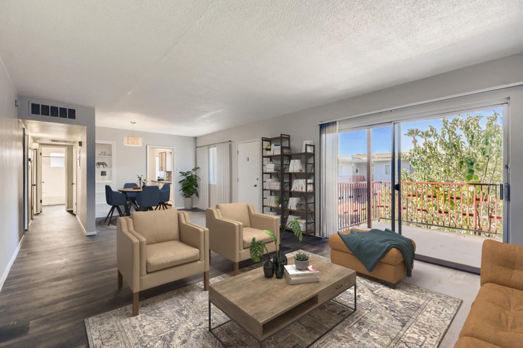 a living room with furniture and sliding glass doors to a balcony