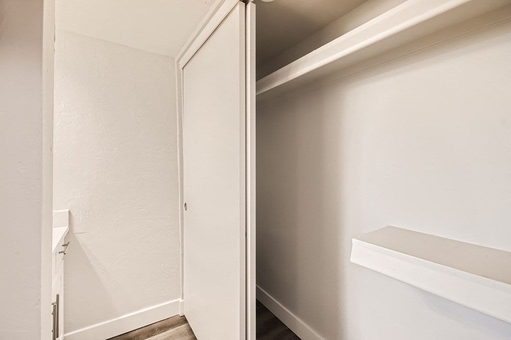 a walk in closet in a 555 waverly unit