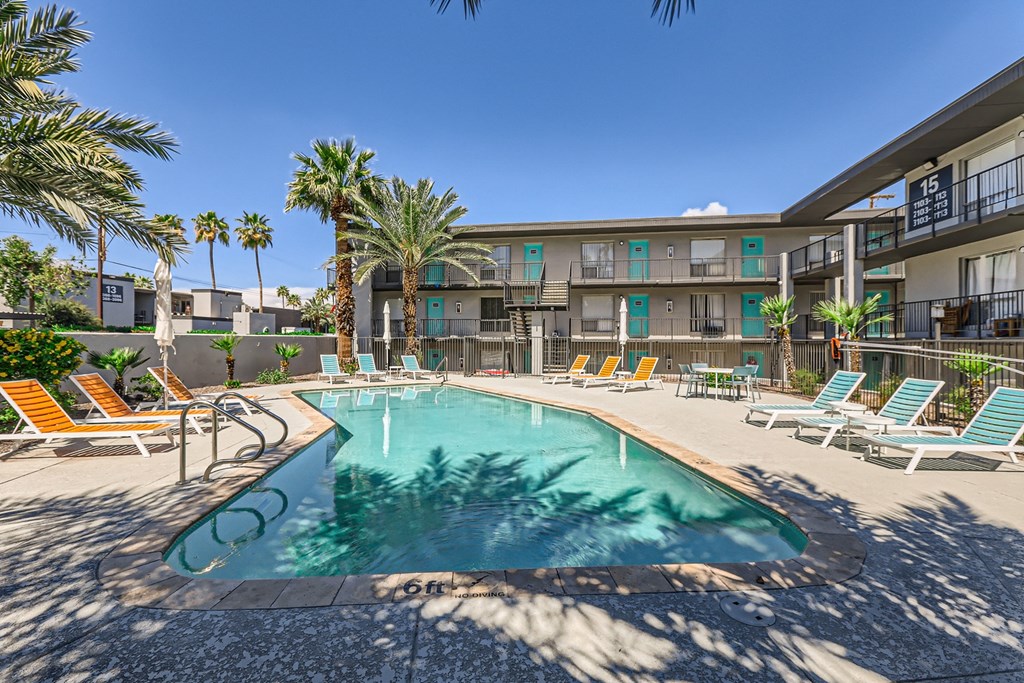 our apartments have a resort style pool and lounge chairs