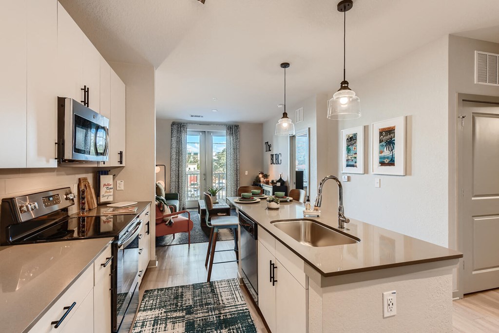 a kitchen with a sink and a counter top