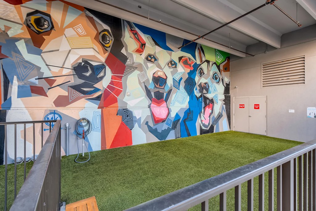 a mural in a building with green grass