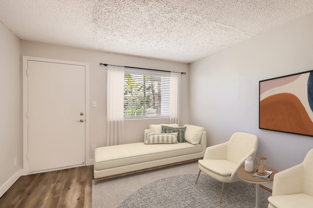 a living room with a couch and two chairs