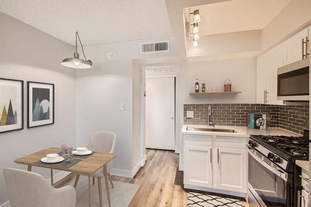 a kitchen and dining area in a 555 waverly unit