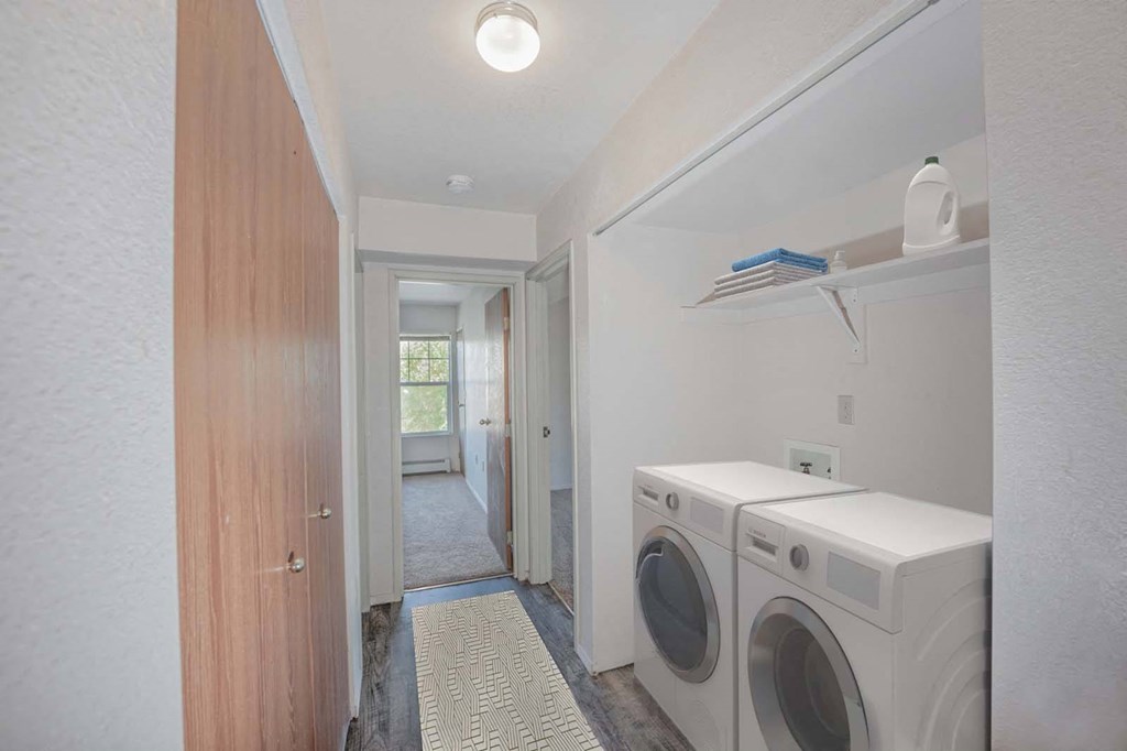 a laundry room with a washer and dryer in it