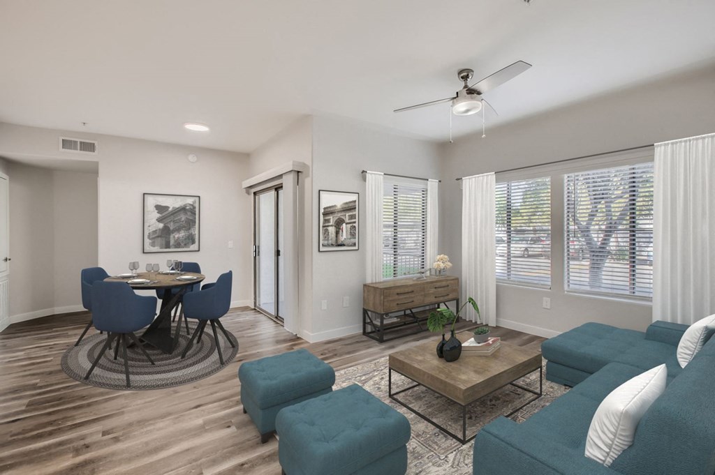 a living room with a couch and a table with chairs