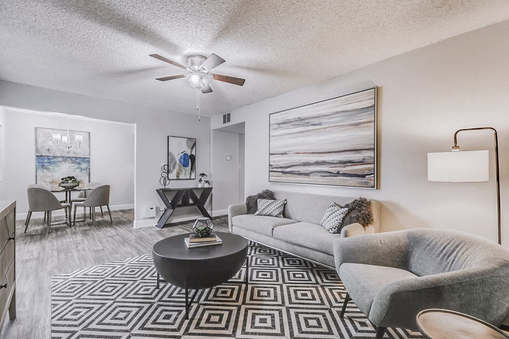 our apartments offer a living room with a couch and a table