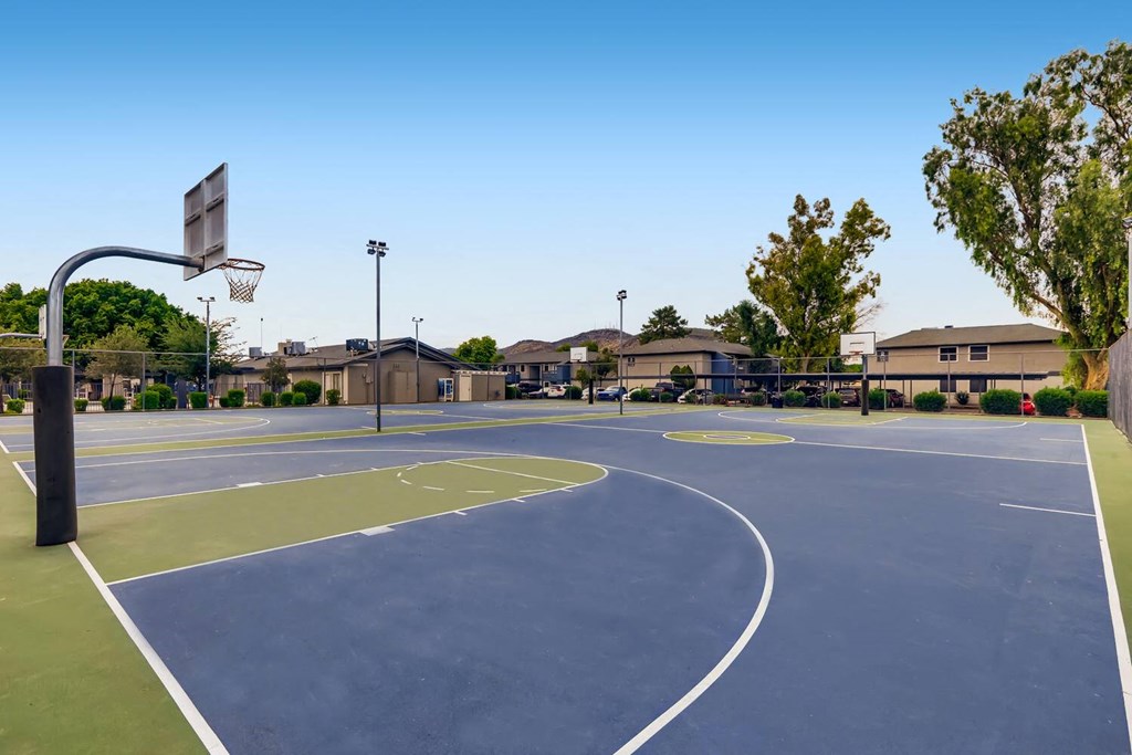 a basketball court in the middle of a city street