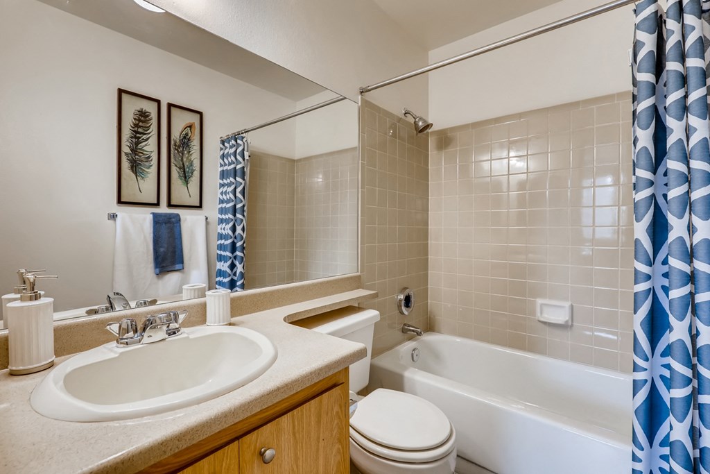 a bathroom with a sink toilet and a tub