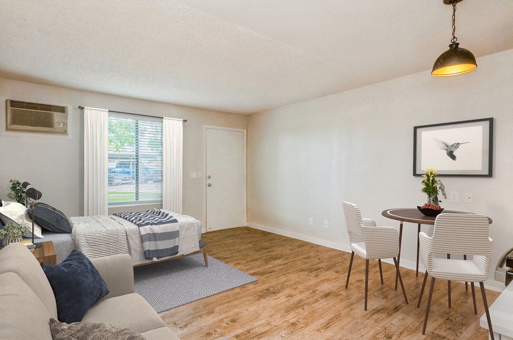 a living room and dining room with a couch and a table