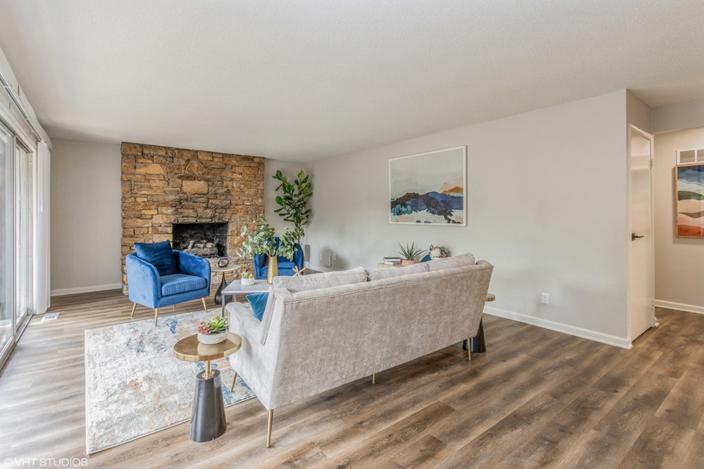 a living room with a couch and a fireplace