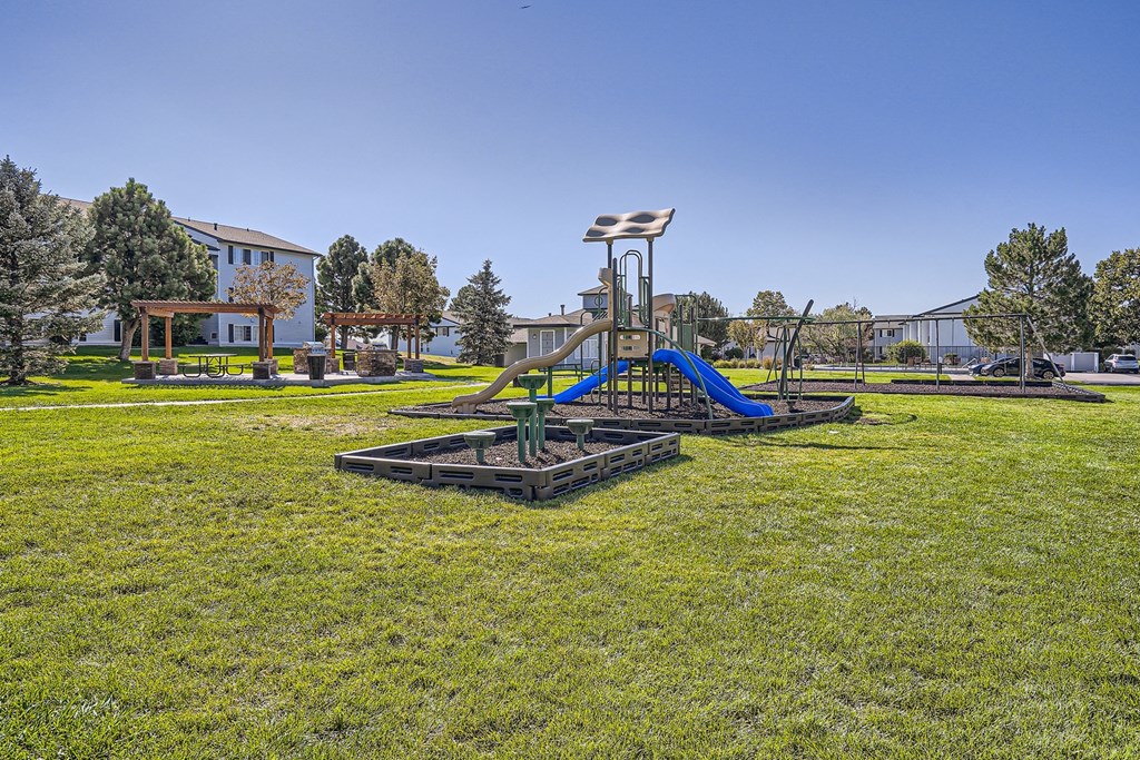 a playground at the enclave at woodbridge apartments in sugar land, tx