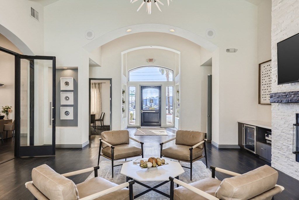 a living room with couches and chairs and a fireplace
