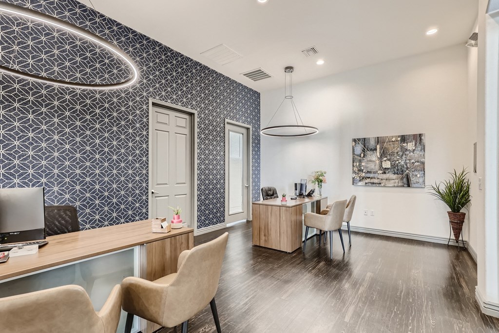 a reception area with a desk and chairs and a table with a chair