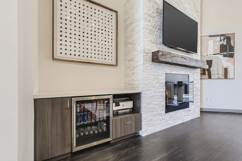 the preserve at ballantyne commons apartments clubhouse with fireplace and tv
