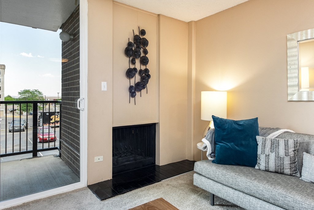 a living room with a couch and a fireplace