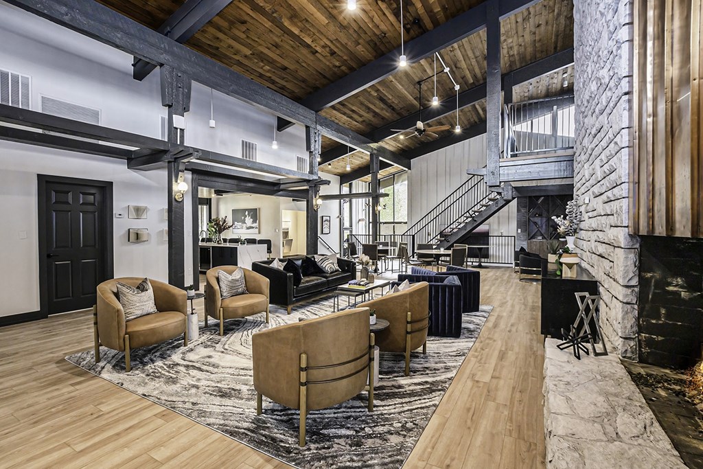 a large living room with furniture and a fireplace