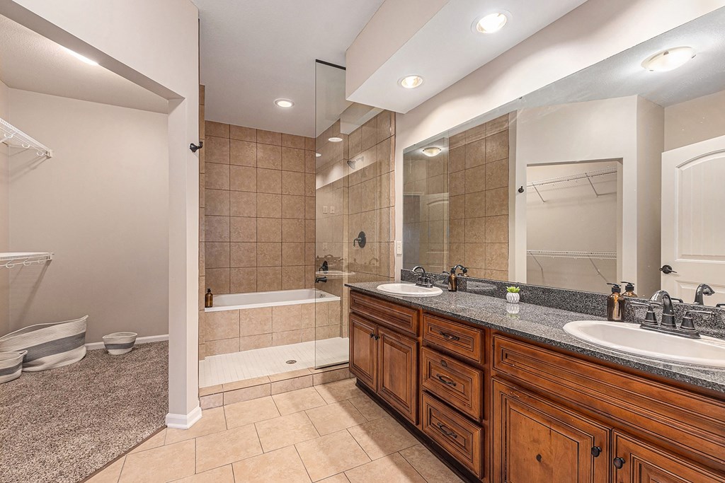 a bathroom with a bathtub and a sink