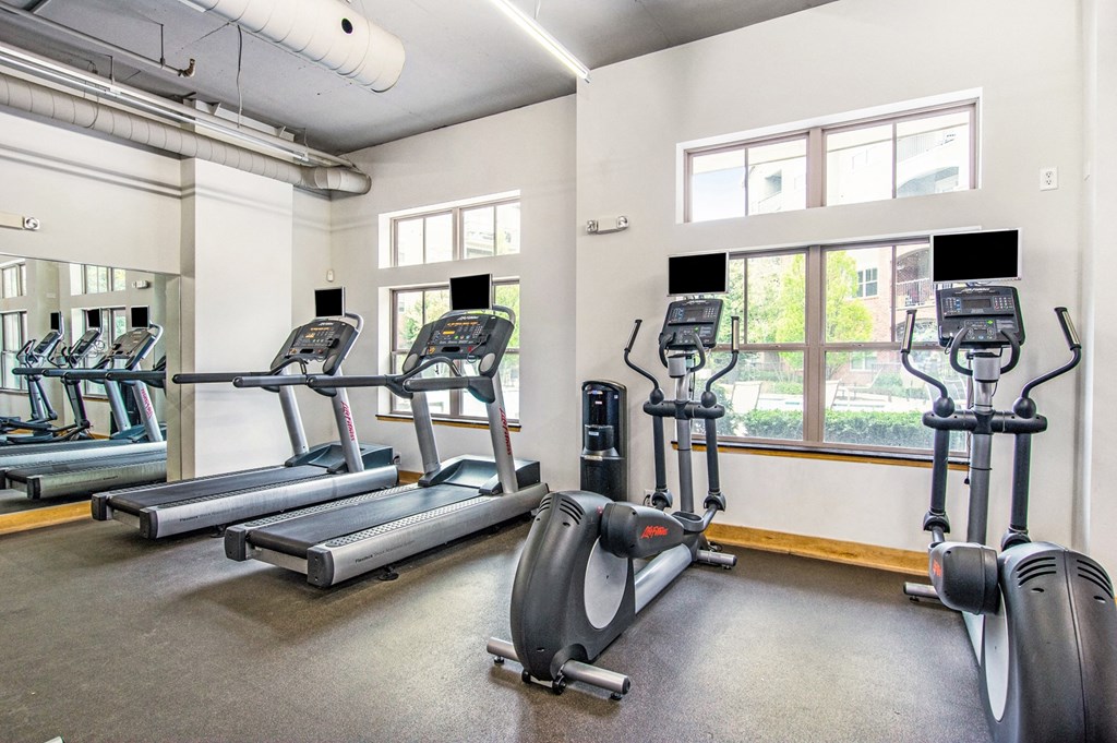 the gym has cardio equipment and treadmills at the belgard apartments